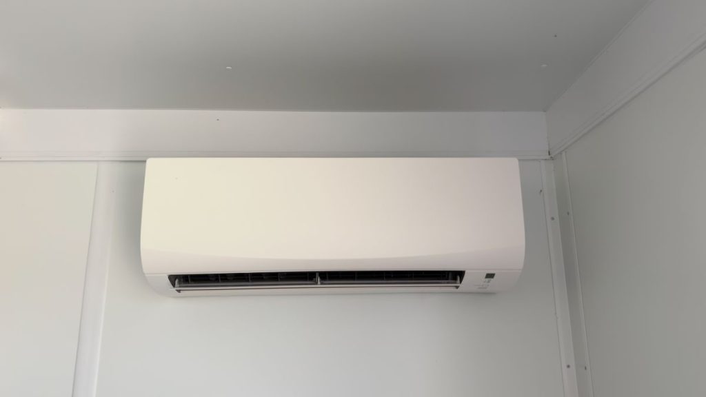 A-modern-white-ductless-mini-split-air-conditioner-mounted-on-a-wall