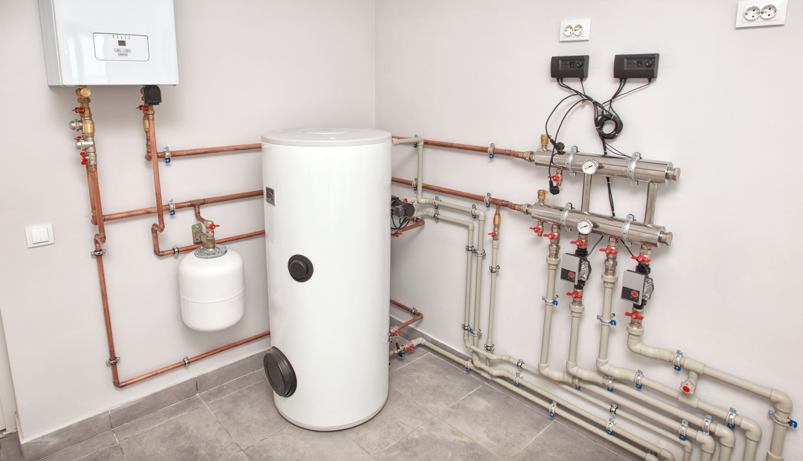 The boiler room with a lot of different equipment as a boiler, h
