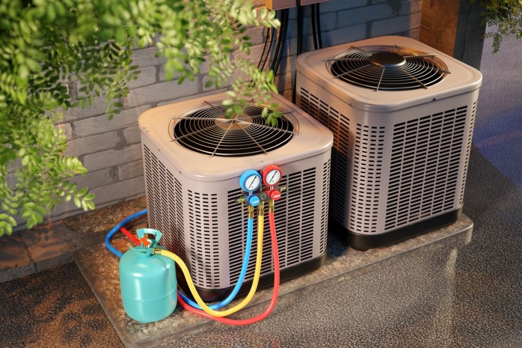 HVAC-maintenance-with-refrigerant-gauges-and-gas-cylinder-connected-to-outdoor-air-conditioning-units